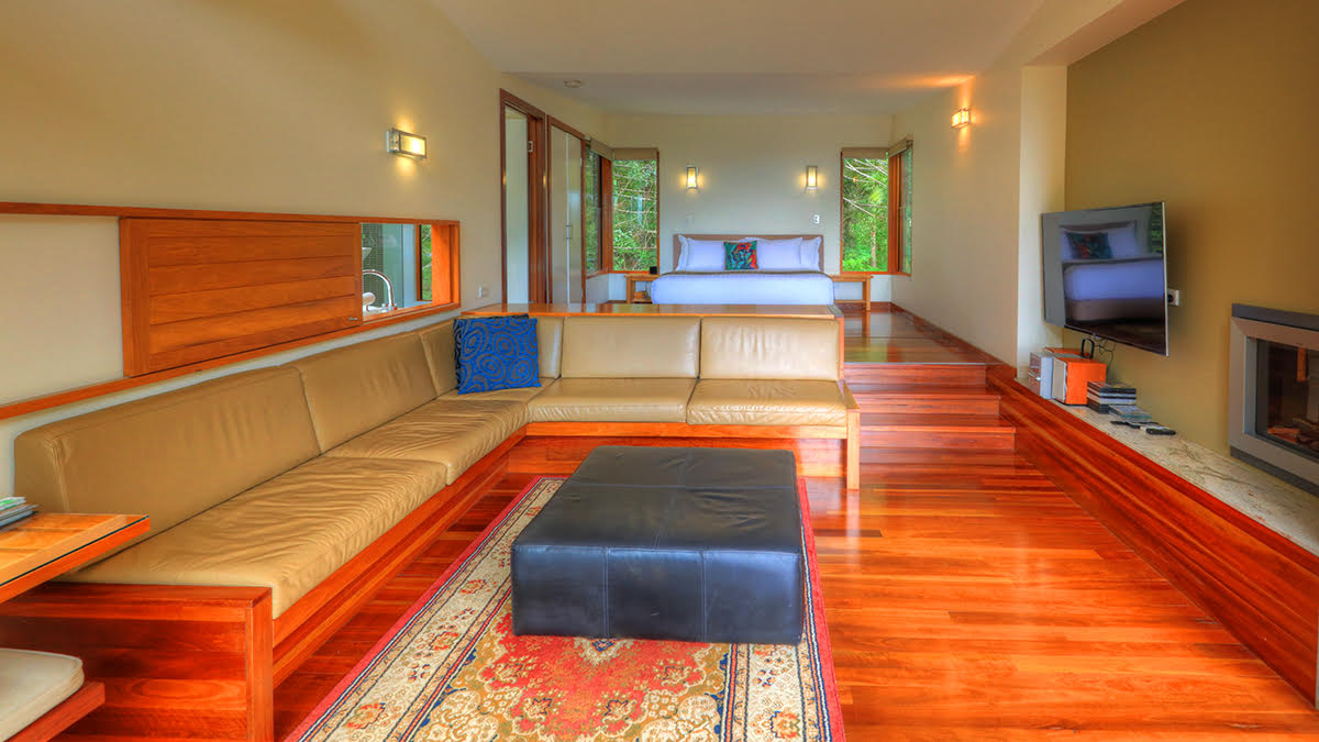 Montville accommodation living room with fireplace and timber floors