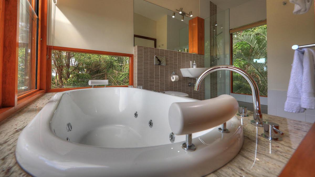 Montville accommodation spa bath with rainforest views